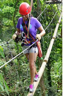 The rope course of this zipline starts with a section of floating logs